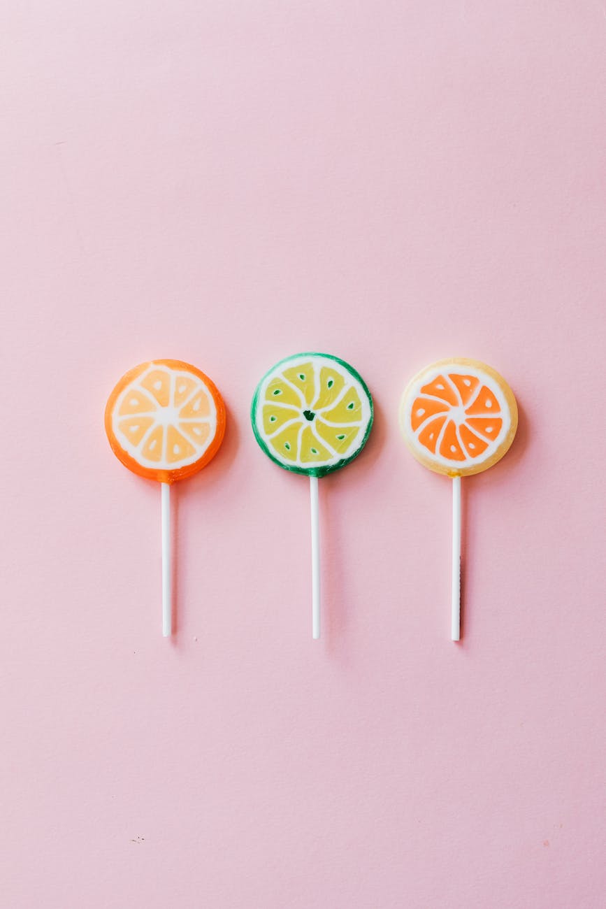multicolored candies on plastic sticks