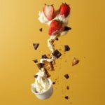 spilling a cup of ice cream with toppings